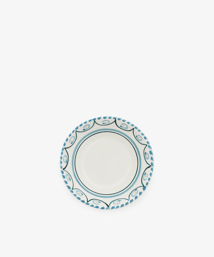The Ottoline Cereal Bowl, Set of 4, features a round ceramic design with a white center and blue patterned border, displayed on a plain white background.