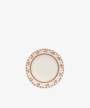The Ottoline Cereal Bowl, Set of 4, features a cream center with a decorative brown and blue patterned rim from the Tess Newall collection. Photographed on a plain white background, these artisanal bowls add charm to any table setting.