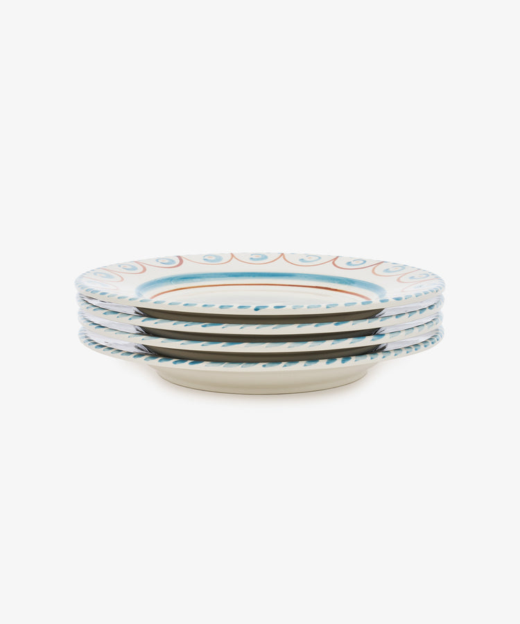 A set of four Ottoline Dinner Plates by Tess Newall, each hand-painted with a blue and orange decorative rim, displayed on a white background.