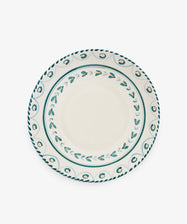 Ottoline Serving Bowl with a white center and decorative teal pattern around the rim, reminiscent of a Tess Newall hand-painted piece, photographed from above on a white background.
