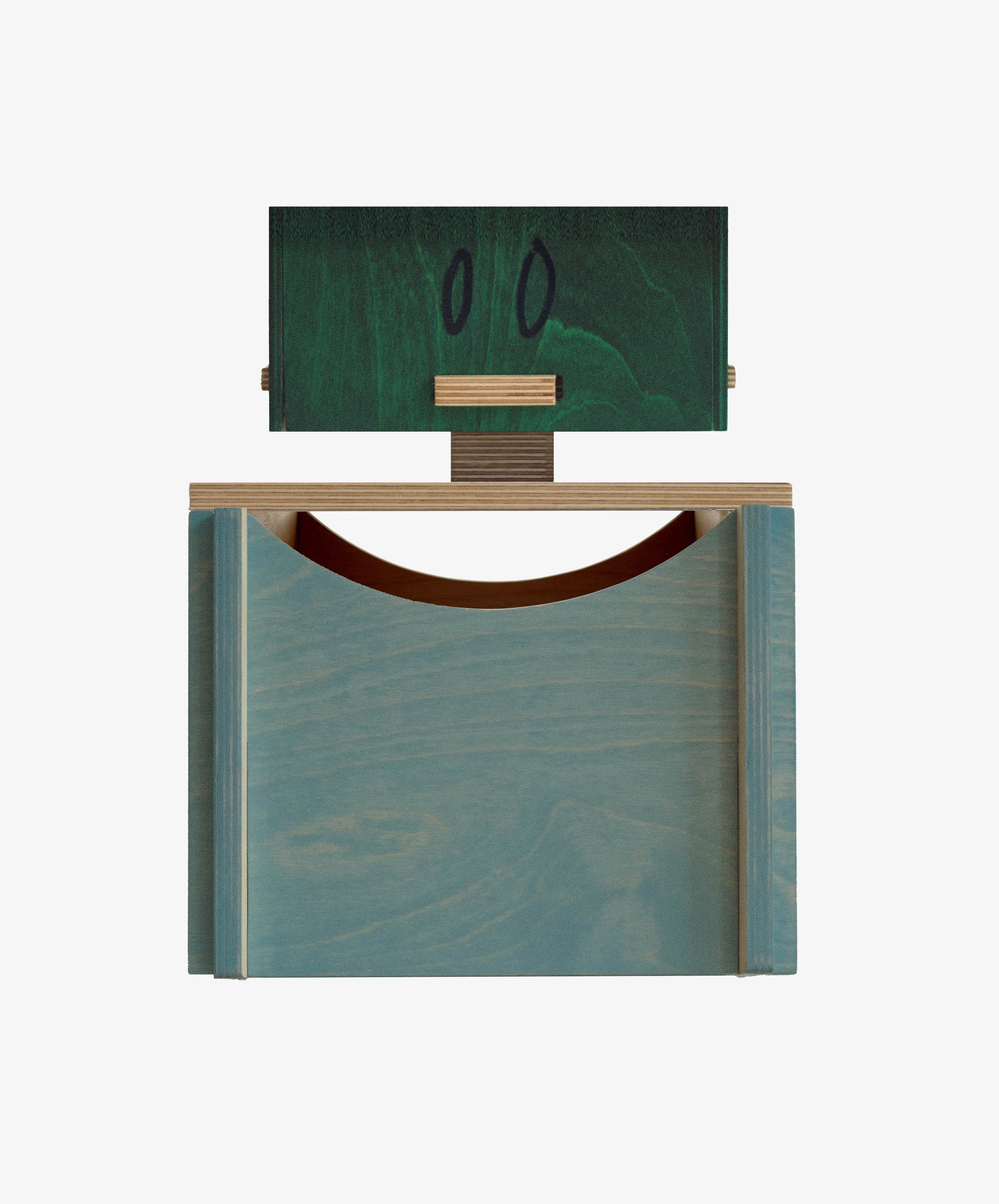 The Milo Keepsake Box by PORTA House of RoRo is a geometric wooden sculpture with a blue base, green block adorned with two black ovals, and a horizontal wood piece—like a modular keepsake box for your modern puzzle treasures.