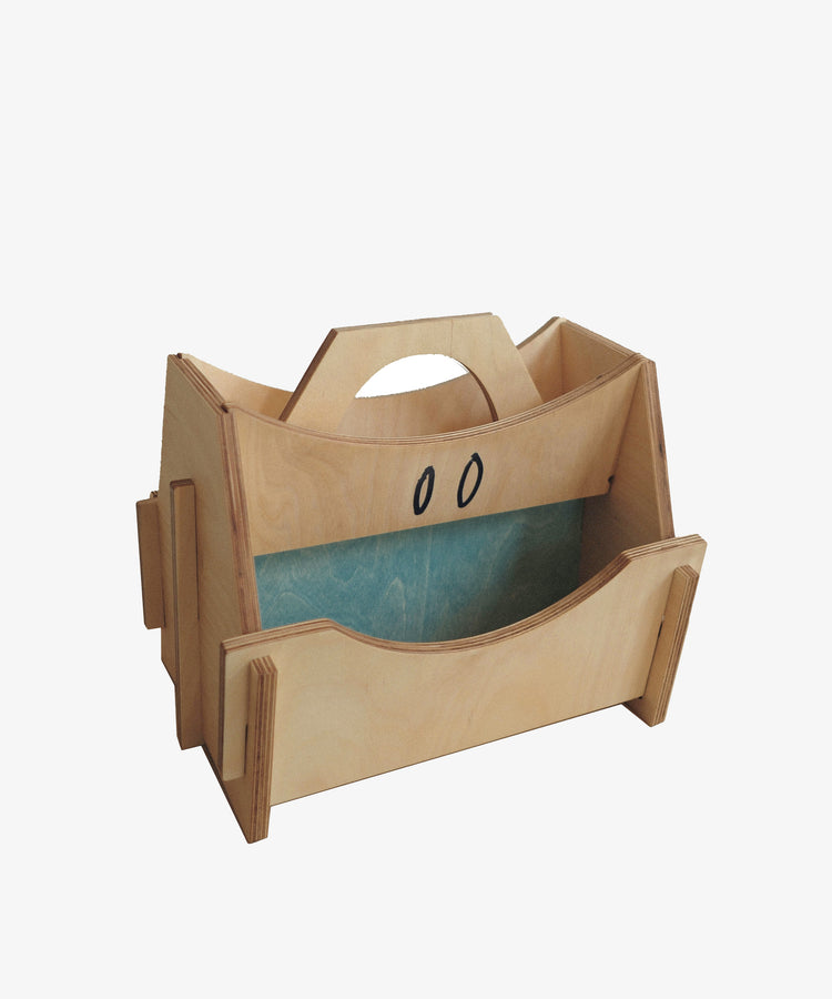 The Casper Caddy is a wooden organizer with a handle, central divider, and open sides—ideal for kids’ storage or organizing household items.