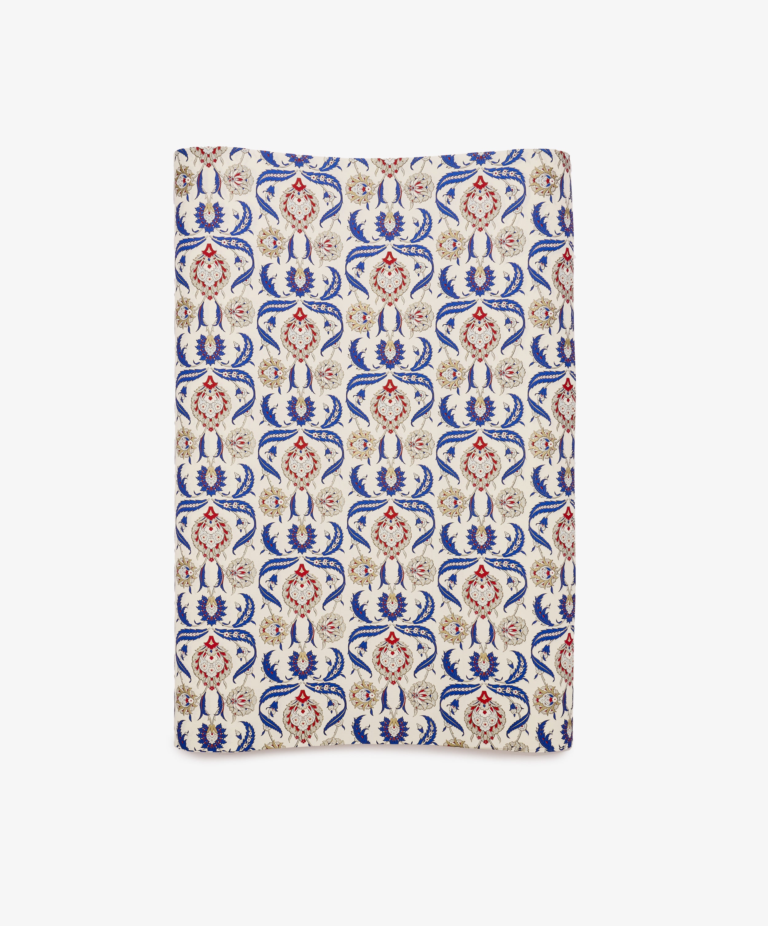 Arabesque Gift Wrap featuring a rectangular textile design with an ornate repeating pattern in red, blue, and beige on a cream background, showcasing symmetrical floral motifs and abstract Arabesque elements.