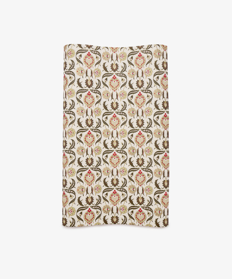 Arabesque Gift Wrap featuring a repeating ornate floral and vine pattern in brown, red, and beige tones on a white background.