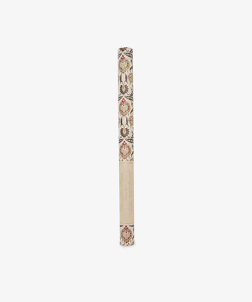 A rolled tube of Arabesque Gift Wrap, featuring elegant floral motifs and a leaf pattern in red, brown, and beige tones, displayed upright on a white background.