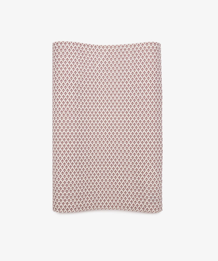 Lilies Gift Wrap—rectangular sheet featuring a small red geometric pattern on a white background—displayed against a plain white surface.