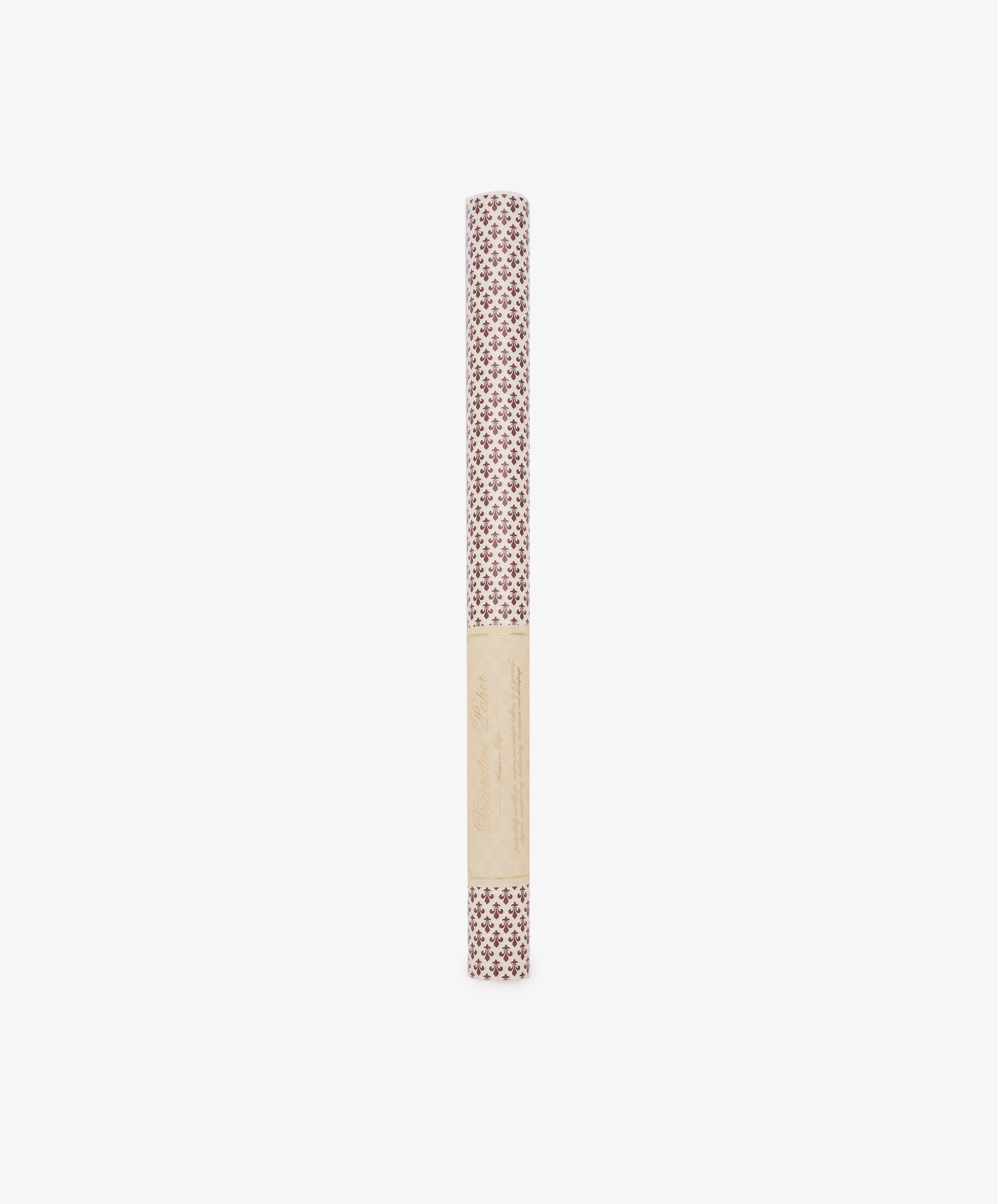 A rolled sheet of Lilies Gift Wrap featuring a red floral design, wrapped in a beige label, stands upright on a white background.