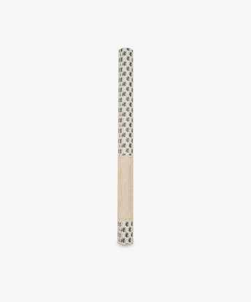 A roll of Rampant Lions Gift Wrap featuring a green botanical print on a subtle cream background, wrapped in a beige paper label and displayed against a plain white backdrop.