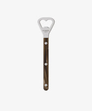 The Bottle Opener features a long, brown marbled handle with three silver rivets, inspired by Sabre’s classic French Bistrot cutlery set and displayed against a plain white background.