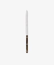The Bistrot Bread Knife features a serrated blade, a brown handle with silver rivets, and is ideal for busy kitchens. It is shown vertically against a plain white background.