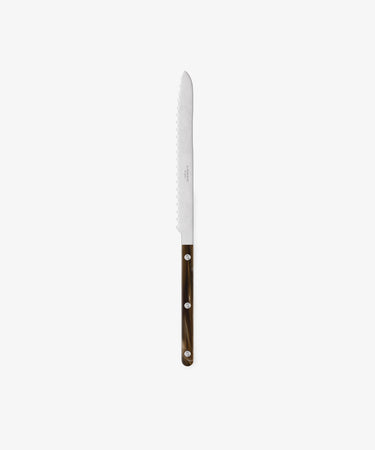 The Bistrot Bread Knife features a serrated blade, a brown handle with silver rivets, and is ideal for busy kitchens. It is shown vertically against a plain white background.