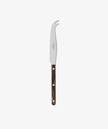 The Large Cheese Knife, inspired by French bistrot cutlery, has a curved stainless steel blade, forked tip, and a dark brown handle with three metal rivets, displayed on a white background.