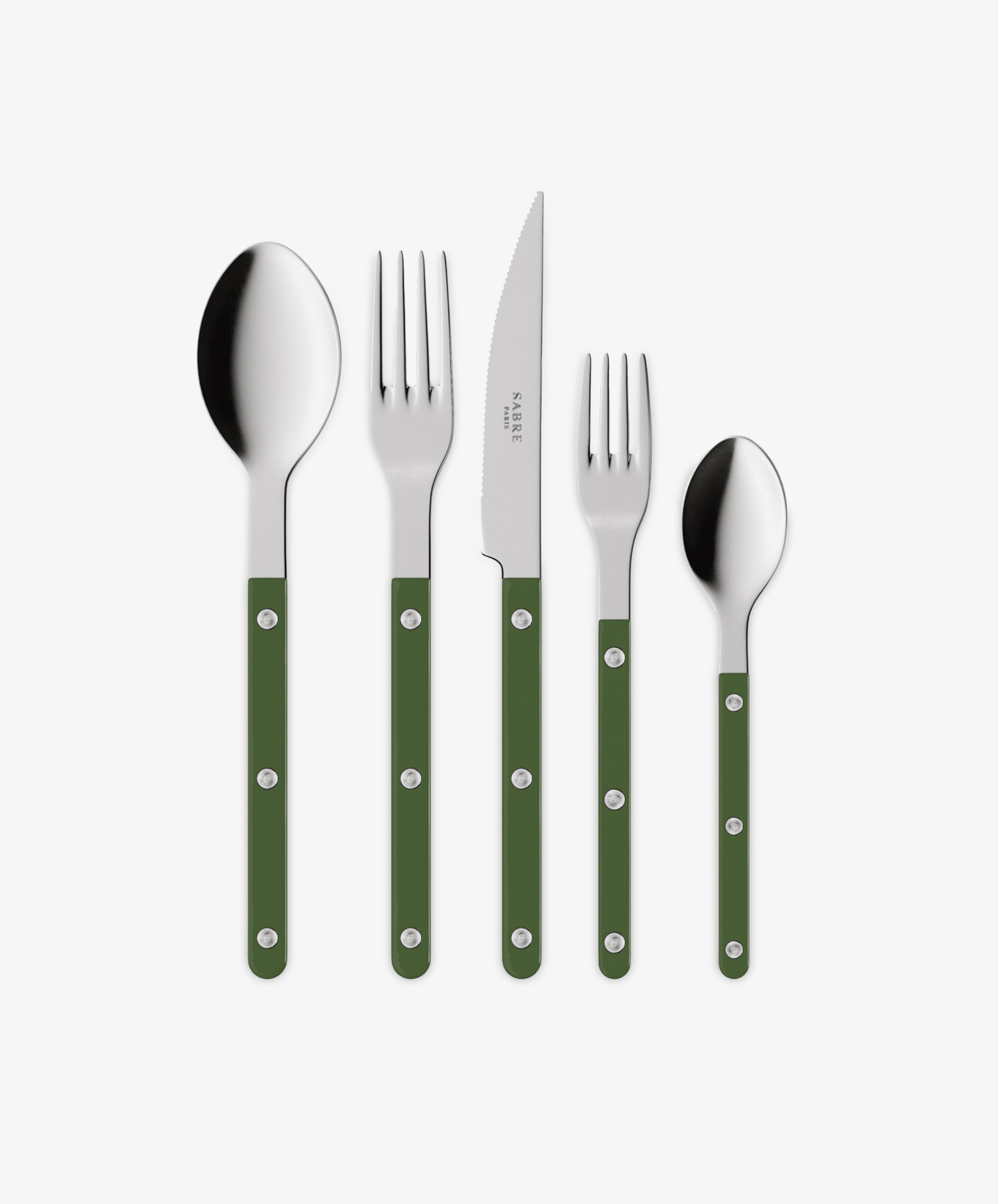 The Bistrot 5 Piece Cutlery Set features a tablespoon, dinner fork, knife, salad fork, and teaspoon with green handles and metal rivets, echoing classic French café style. They are arranged side by side on a white background.
