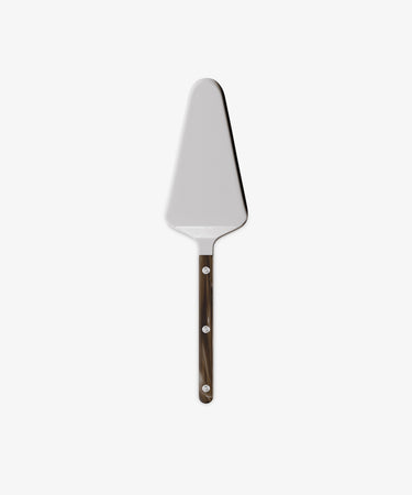The Tart Server from the Sabre bistrot cutlery set features a triangular metal blade and dark handle, shown against a plain white background—an elegant and stylish addition to your kitchen utensils collection.
