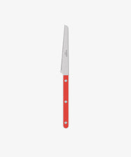 The Tomato Knife, featuring a red handle with three metal rivets, is displayed against a plain white background, making it a standout addition to any kitchen utensil collection.