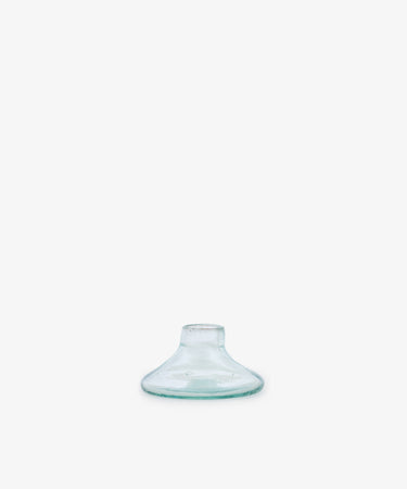 The Lucien candleholder, Small, features clear recycled glass with a wide flat base and short narrow neck, shown centered on a plain white background.