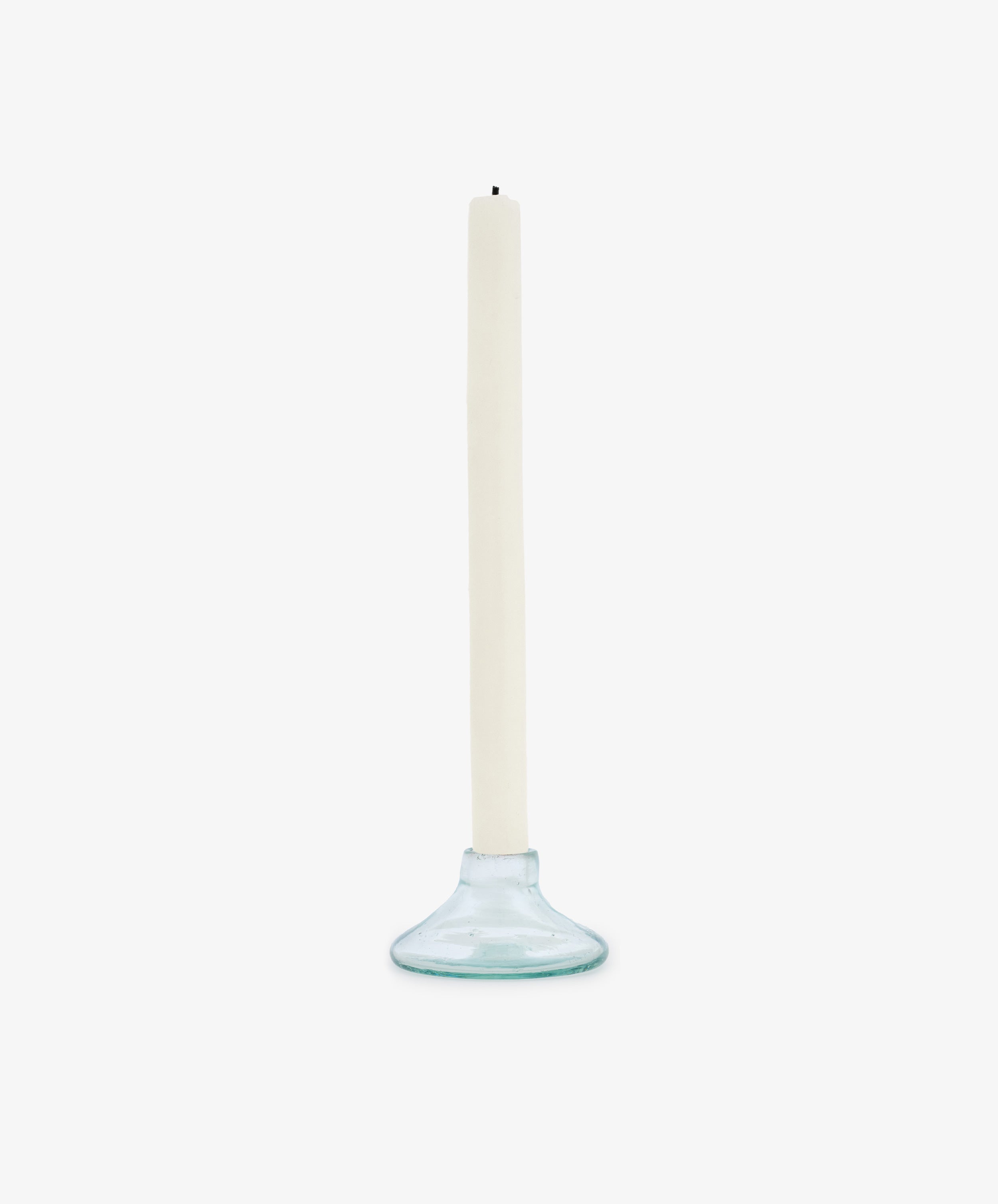 The Lucien candleholder, crafted from handblown recycled glass, holds a tall white taper candle and is displayed against a plain white background.