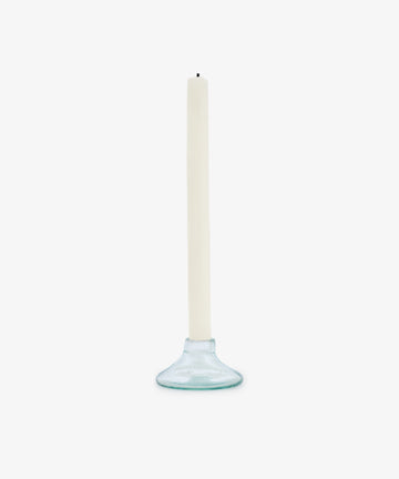 The Lucien candleholder, Large—a simple, clear recycled glass piece crafted by hand—holds a white taper candle upright against a plain white background.