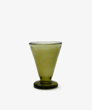 The Elodie Footed Wine Glass, Set of 6, features green handblown Moroccan glass cups with flared rims and thick, round bases, crafted from recycled glass and photographed on a plain white background.