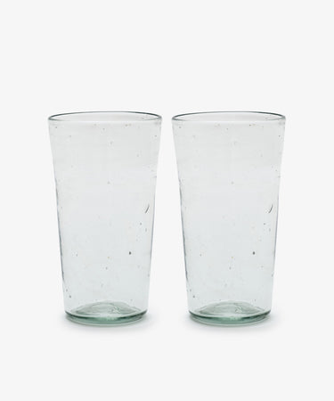 Six clear, slightly textured Elodie Water Glasses are placed side by side on a white background.