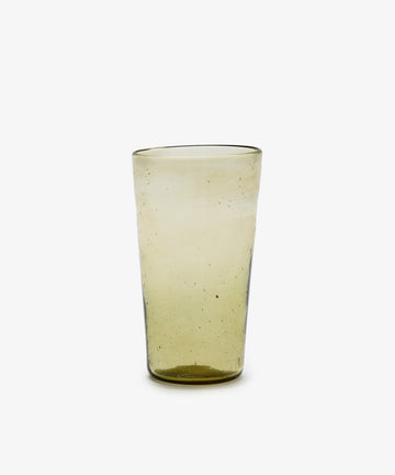 The Elodie Water Glass, Set of 6, features handblown, slightly yellow recycled glass from Morocco with a smooth finish and subtle air bubbles, shown upright on a plain white background.