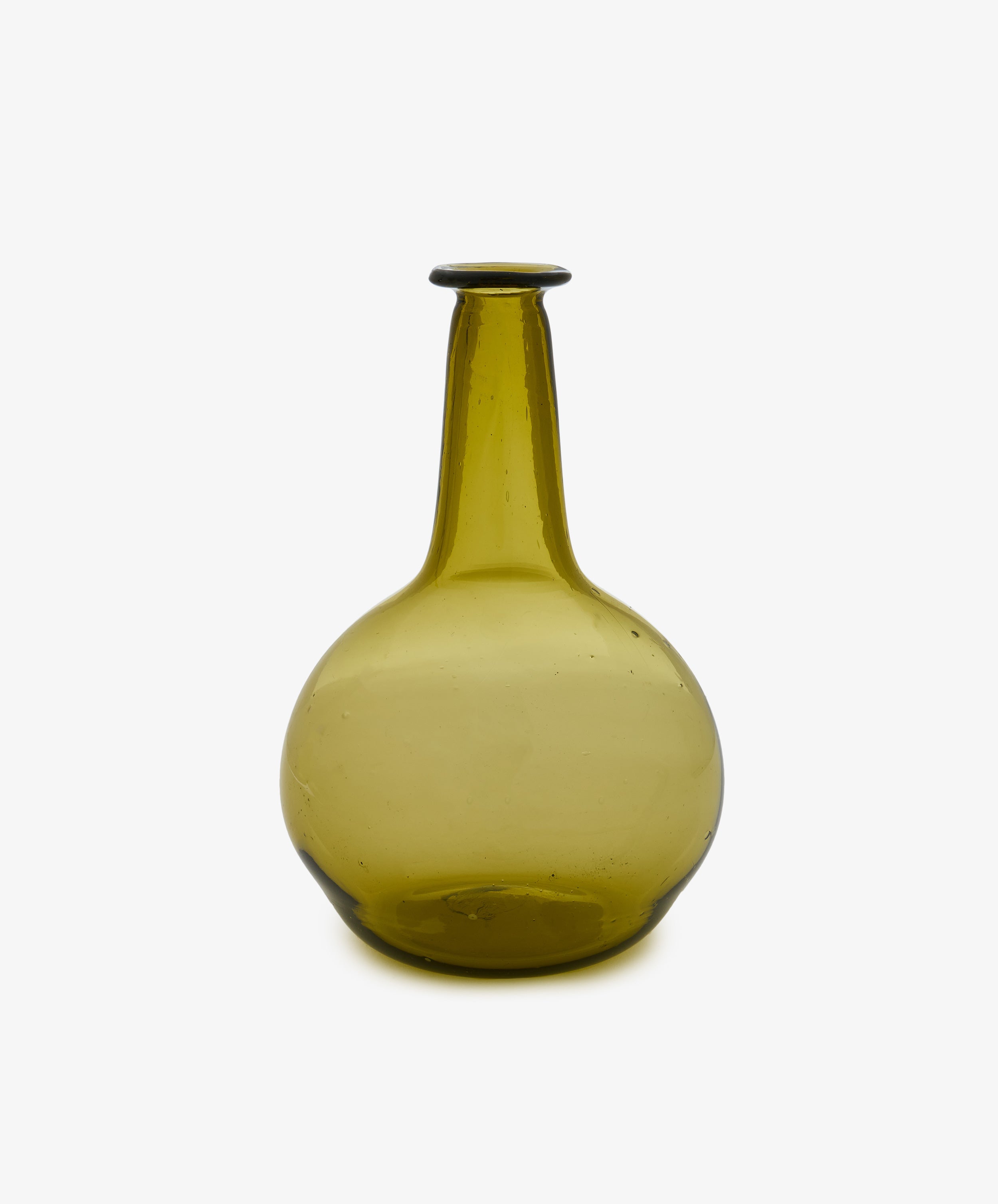 The Elodie Bedside Carafe and Glass Set is an olive-green, hand-blown glass bottle featuring a round bottom and a long, narrow neck—ideal as a nightstand or bedside water carafe—shown against a plain white background.