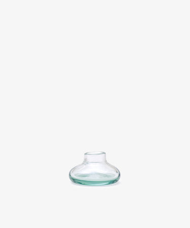 Lucien bubble candleholder, Small—handblown clear glass from Morocco, features a wide, flat base and narrow neck, displayed against a plain white background.