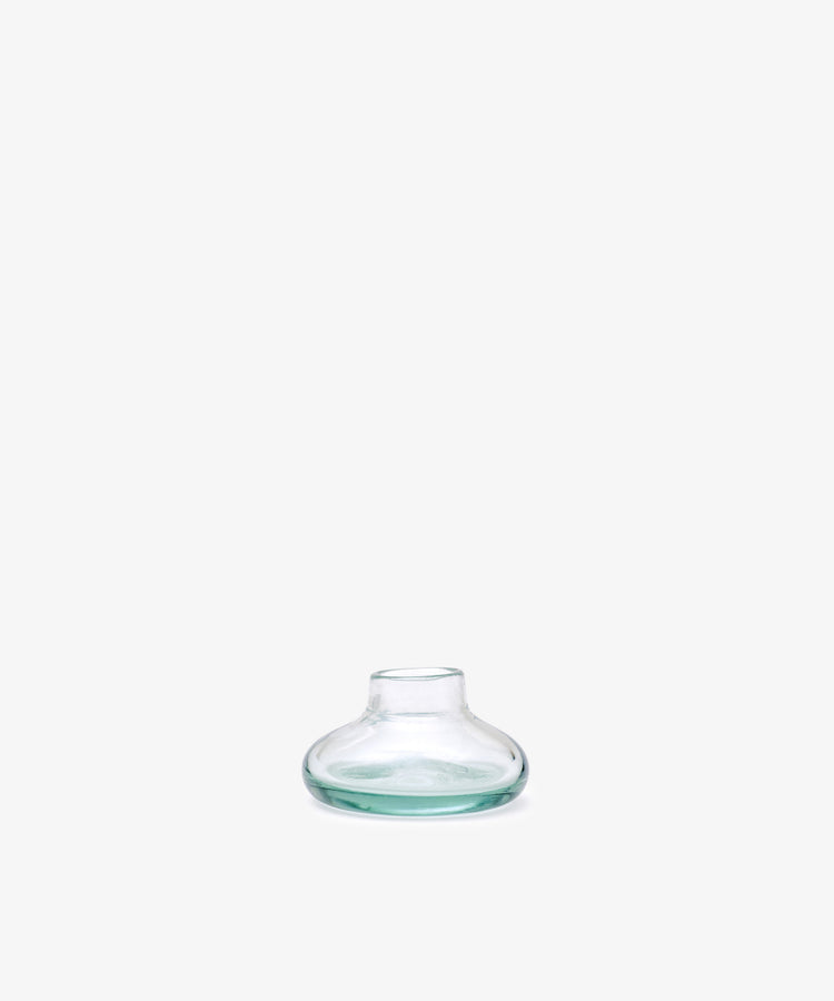 Lucien bubble candleholder, Small—handblown clear glass from Morocco, features a wide, flat base and narrow neck, displayed against a plain white background.