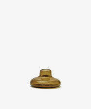 The Lucien bubble candleholder, Large, is a handblown, round amber glass piece with a short neck, crafted in Morocco and photographed against a plain white background.
