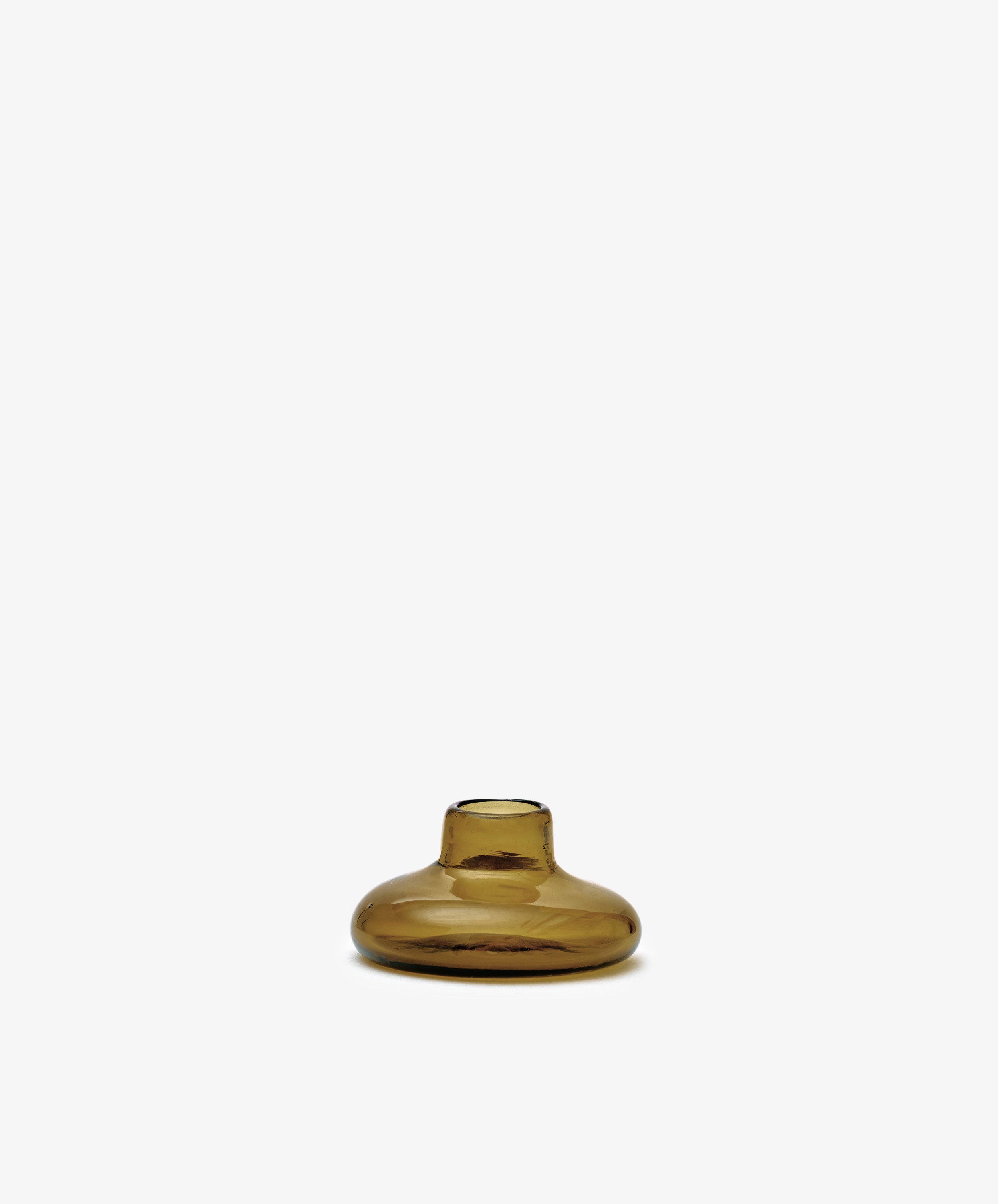 The Lucien bubble candleholder, Small—a handblown, amber-colored glass piece with a narrow opening—stands centered against a plain white background.