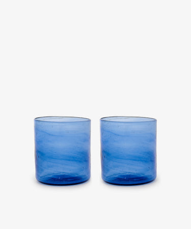 Six Elodie Straight Glasses, crafted from recycled blue glass with a subtle texture, are arranged side by side on a plain white background.