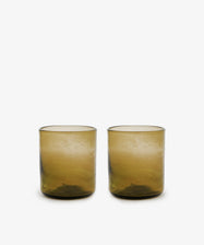 Six Elodie Straight Glass tumblers, handblown from recycled glass with a slightly textured brown surface, are displayed side by side on a plain white background.