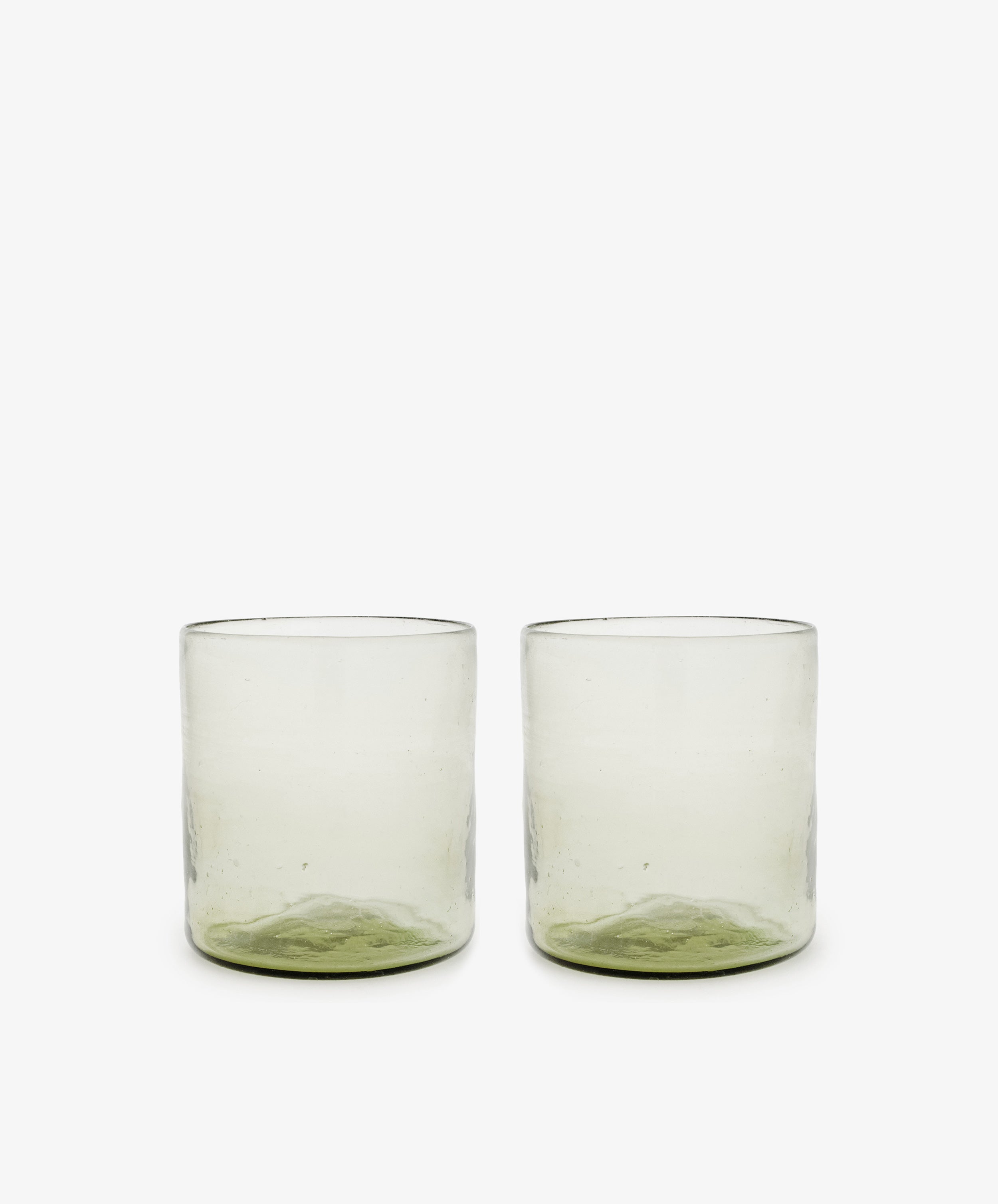 A set of six Elodie Straight Glasses, made from recycled glass with subtly green-tinted bases, are arranged side by side on a plain white background.