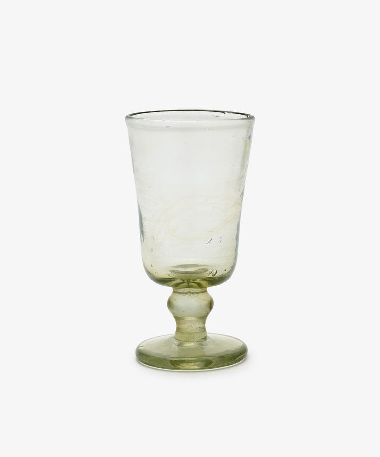 The Elodie Stemmed Wine Glass, Set of 6, features clear recycled glass with a short stem, round base, and slightly flared rim. Each glass is photographed against a plain white background.