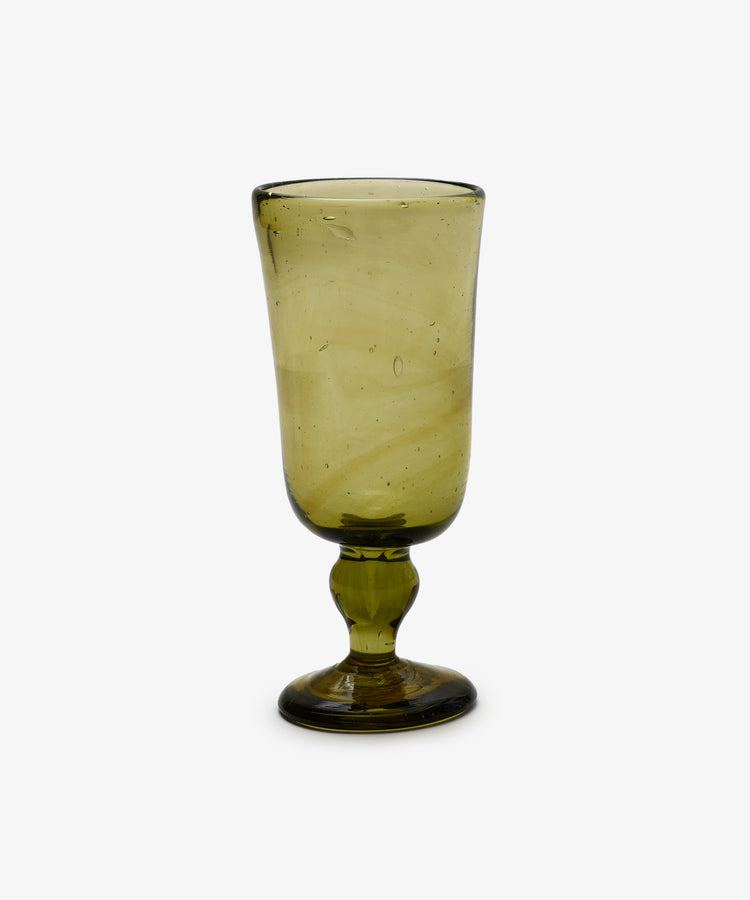 A set of six Elodie Stemmed Wine Glasses, each handblown in Morocco with green-tinted glass, a round base, and gently flared bowl, displayed against a plain white background.