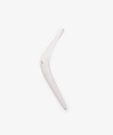 The Vintage Silver Boomerang Letter Opener, with its smooth surface and sleek design, is displayed against a plain light gray background—perfect as a modern desk accessory.