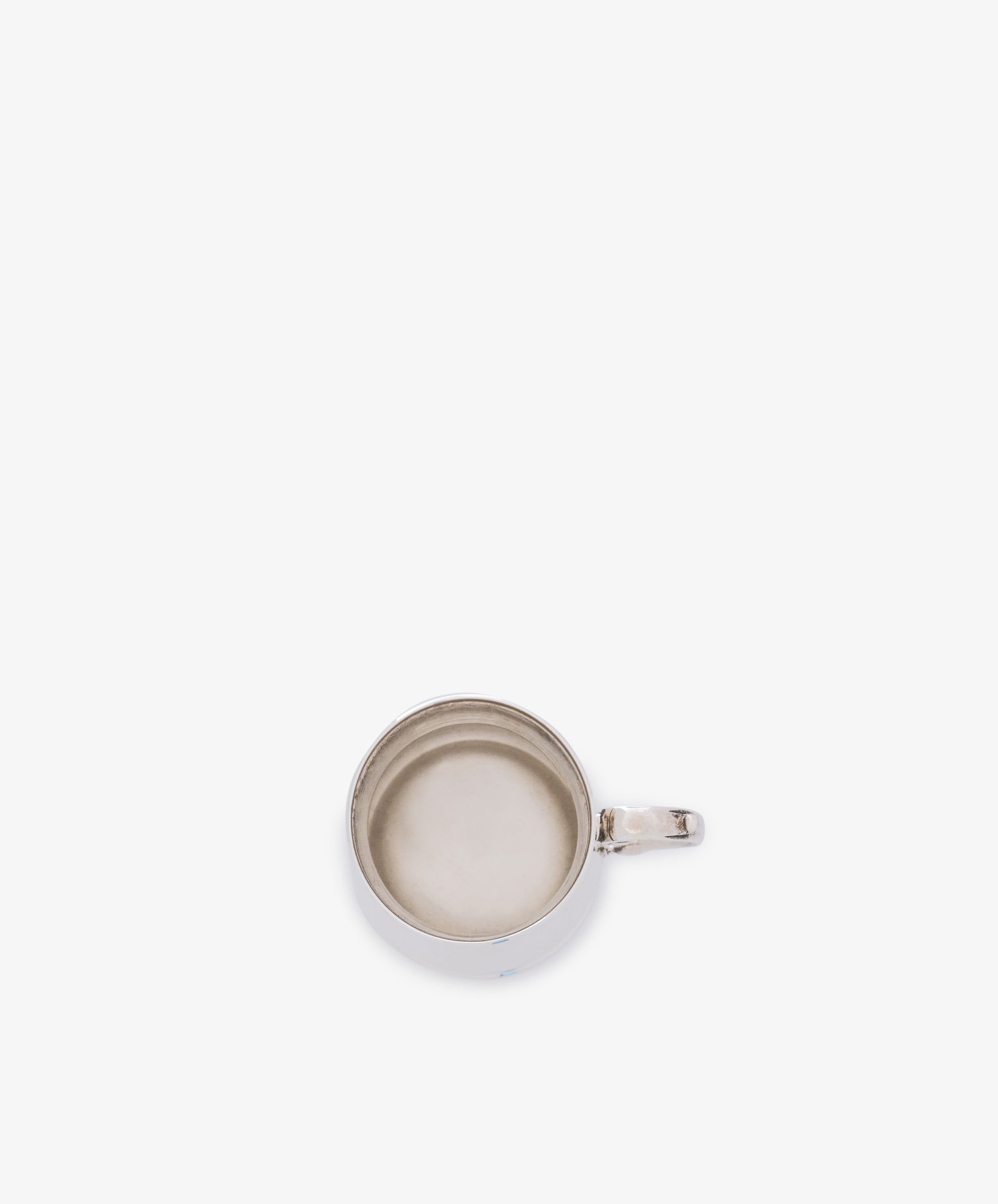 A top-down view of the Vintage English Silver Child's Mug, empty with a handle, centered on a plain white background.