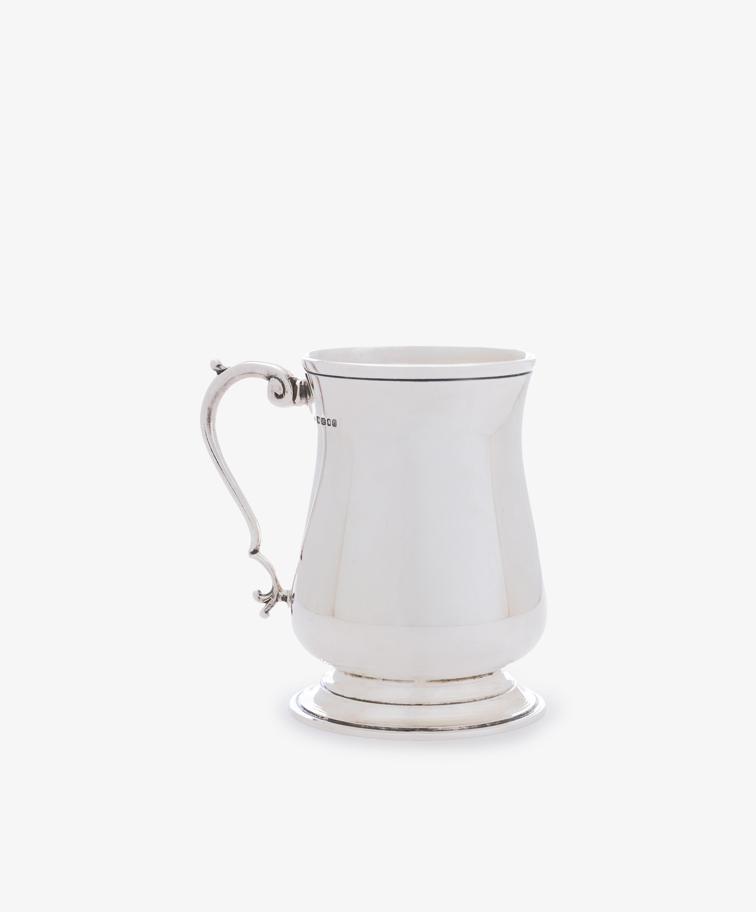 The Vintage English Silver Child's Mug features a curved handle and round base, shown against a plain white background—a timeless gift idea for any special occasion.
