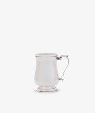 The Vintage English Silver Child's Mug features a polished finish, curved handle, flared base, and gently tapered body, shown against a plain white background.