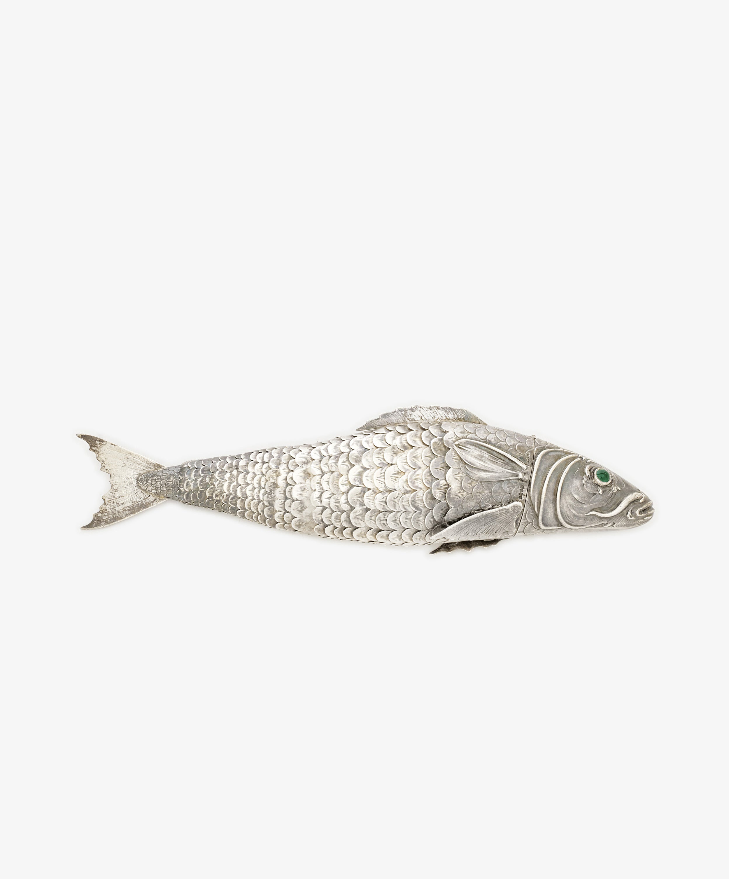 The Vintage Silver Articulating Fish features textured scales, detailed fins, and a green gem eye—a unique vintage charm and lucky talisman, beautifully displayed on a plain white background.