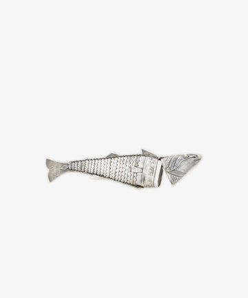 The Vintage Silver Articulating Fish, featuring a segmented body and detailed scales, is showcased against a plain white background.