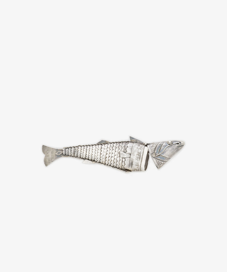 The Vintage Silver Articulating Fish, featuring a segmented body and detailed scales, is showcased against a plain white background.