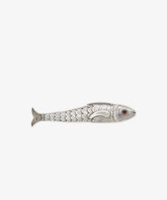 The Vintage Silver Articulating Fish features engraved scales, a red eye, and articulated segments. Shown from the side against a plain white background, this charm is often regarded as a lucky talisman.