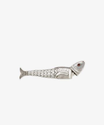 The Vintage Silver Articulating Fish features detailed scales, a red eye, and segmented head. Shown on a white background, this unique charm is often treasured as a lucky talisman.