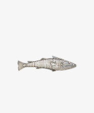 The Vintage Silver Articulating Fish features a segmented, fish-shaped body with detailed fins and is photographed on a white background—a unique talisman believed to bring luck.