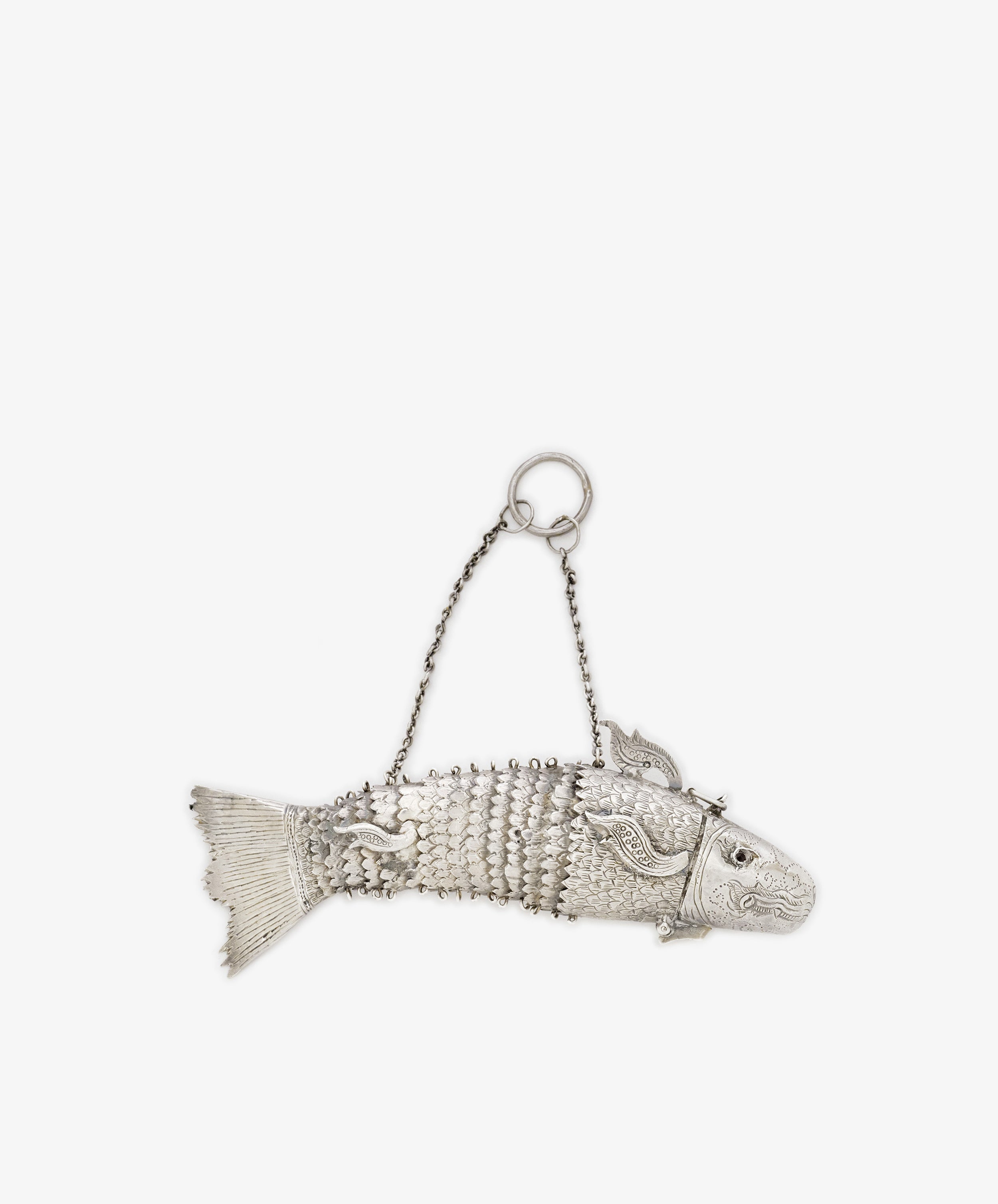The Vintage Silver Articulating Fish is a detailed silver fish container with an articulated charm design, hinged tail, and a chain handle—an ideal unique lucky talisman.