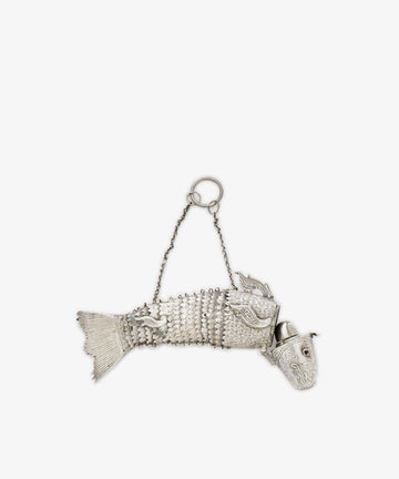 The Vintage Silver Articulating Fish is a charming silver container with a hinged head, decorative scales, and a chain handle on top—an exquisite vintage collectible.