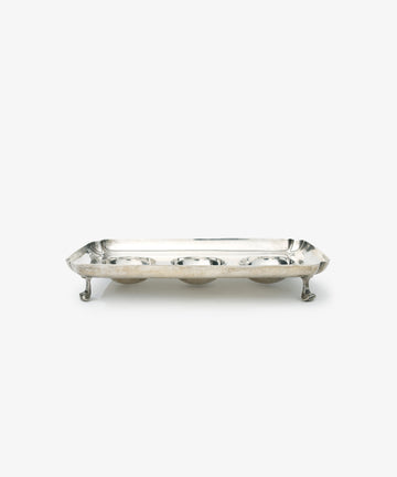 Vintage Silver Inkstand Base with raised edges and four ornate legs, showcased on a white background—a stunning piece for any vintage collection.