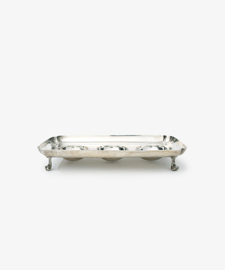 Vintage Silver Inkstand Base with raised edges and four ornate legs, showcased on a white background—a stunning piece for any vintage collection.