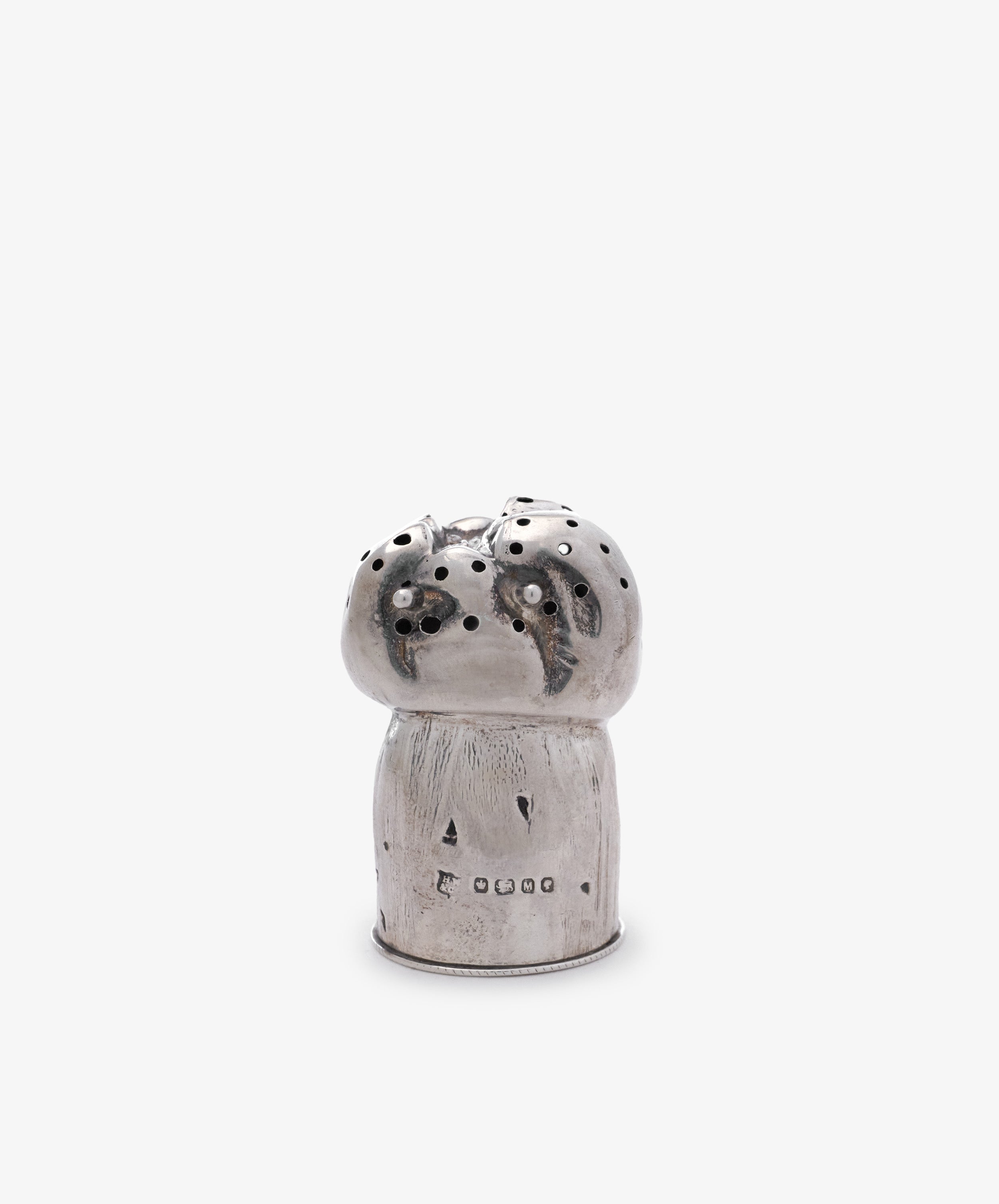 The Vintage English Silver Pepper Pot features a mushroom shape with small holes on top and engraved markings near the base, displayed against a plain white background.